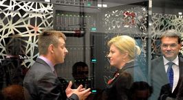A middle-aged man and woman are engaged in a conversation, with the man trying to explain how servers work.