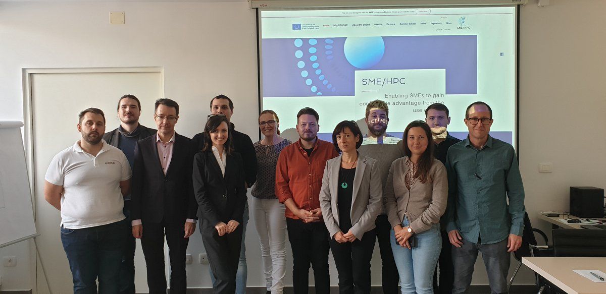 Group photograph of twelve participants at SME/PHC presentation.
