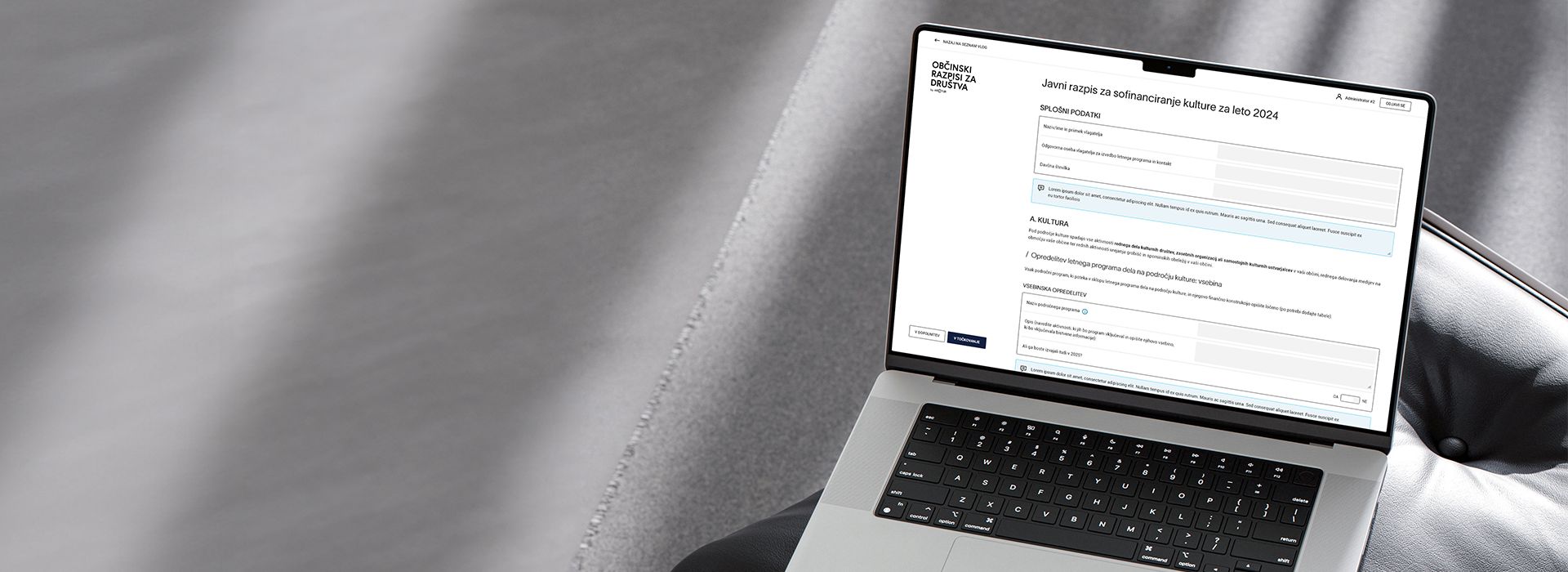 Laptop displaying municipal tender procedures web application.