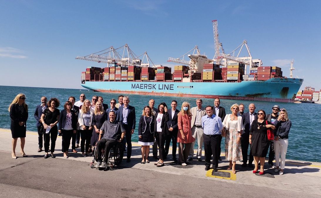 A group photograph of twenty-nine visitors to Luka Koper port.