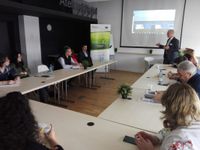 Arctur's CEO & Founder giving a presentation in front of an audience.