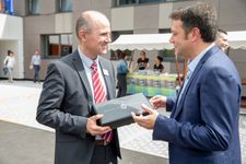Arctur's CEO & Founder receiving a gift.