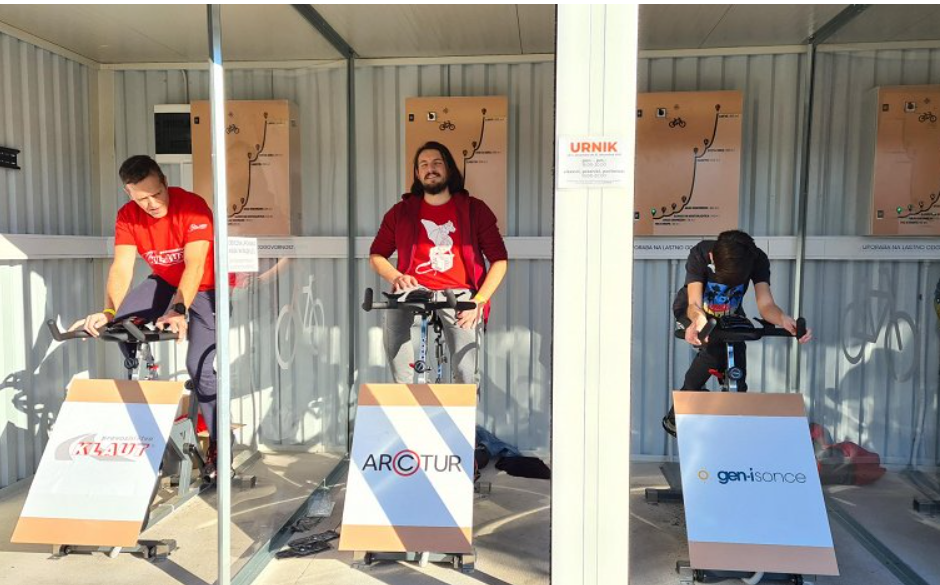 Photograph of three cyclists cycling on exercise bikes at the Goricatlon 2021 event.