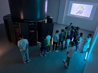 A group of students is being given a tour of Arctur's supercomputer.