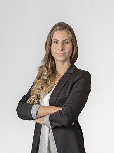 Portrait photograph of Ariana Šumandl, Head of department 4PM. She is a middle-aged woman with long light brown hair, wearing a black jacket, smiling.