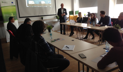 Arctur's CEO & Founder giving a presentation in front of an audience.